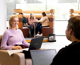 Students sat discussing work